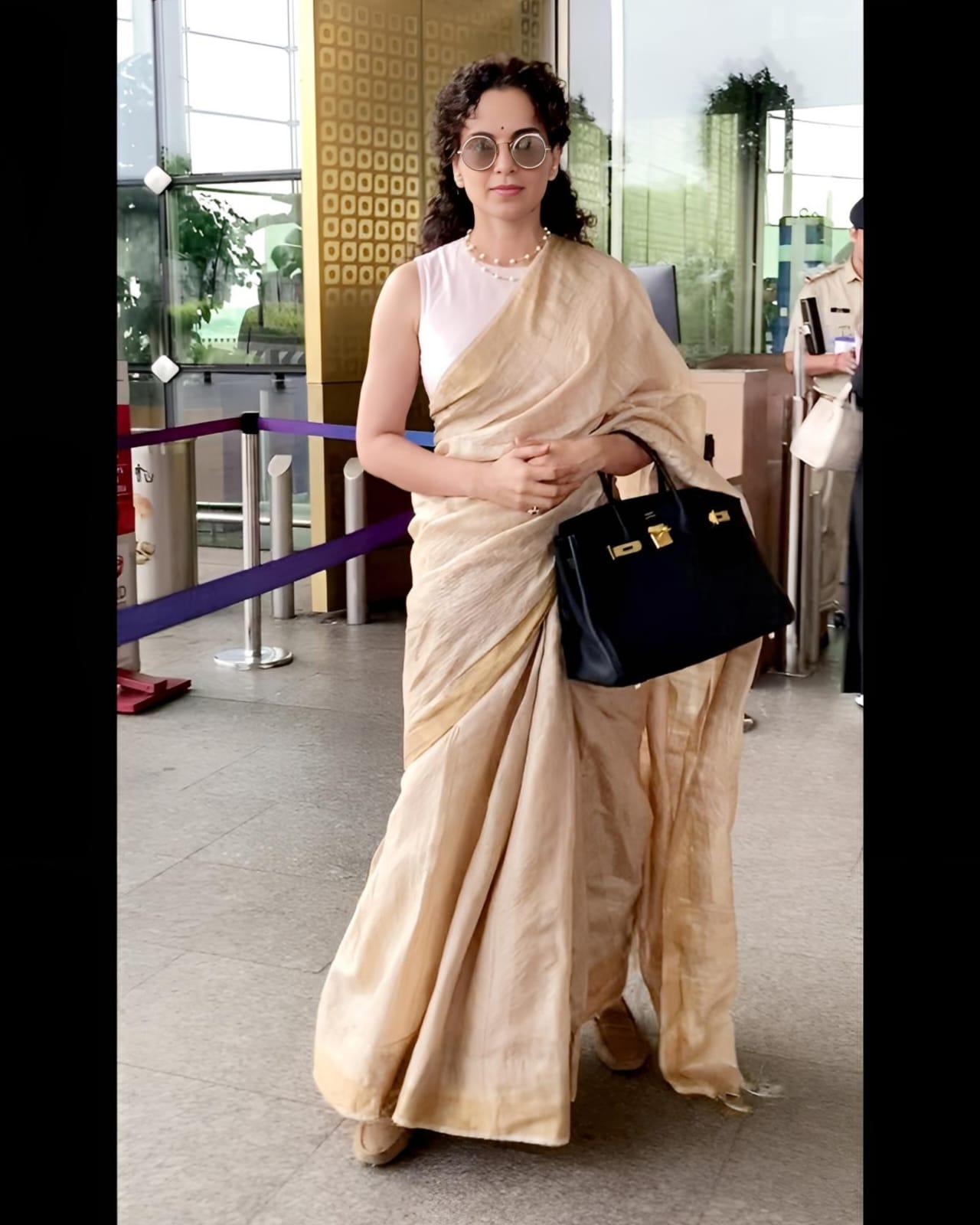 Kangana Ranaut exuded elegance in a cream saree during her recent airport appearance.